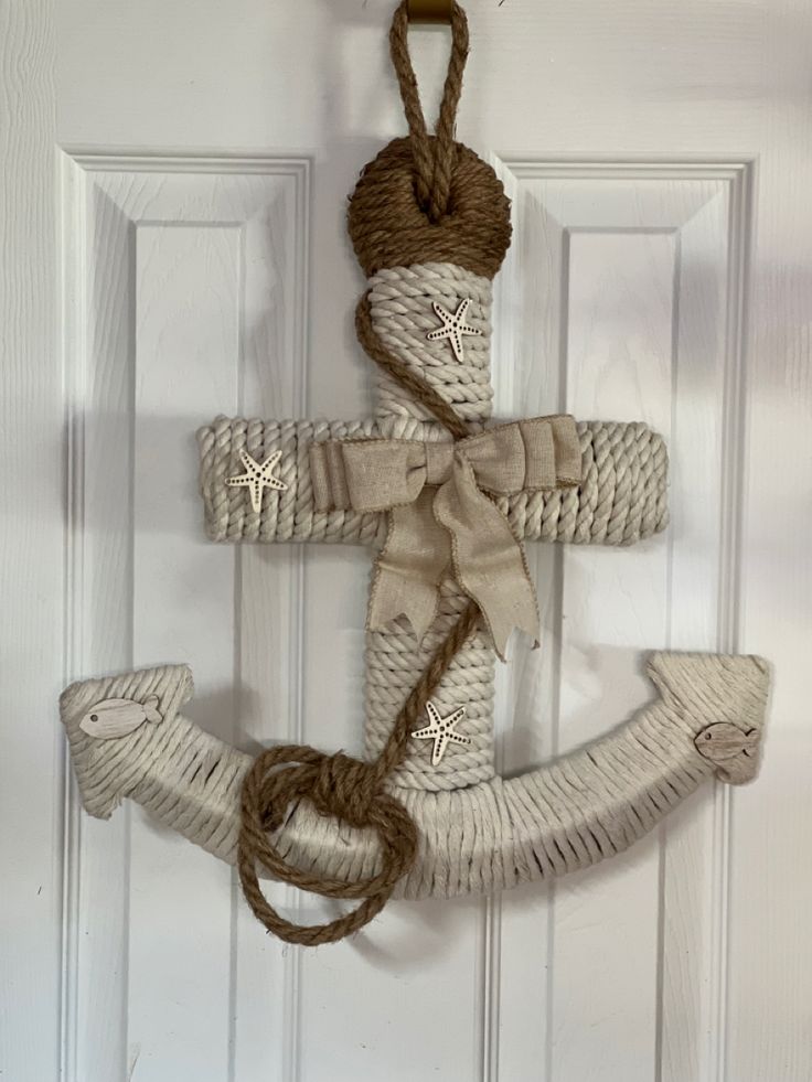 an anchor made out of rope hangs on the door