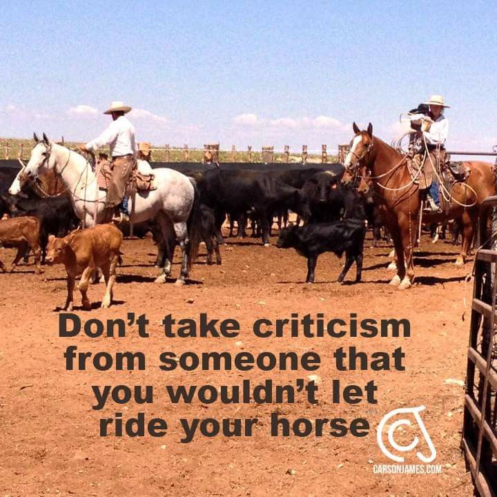 a group of men riding horses next to cattle in a pen with a quote on it