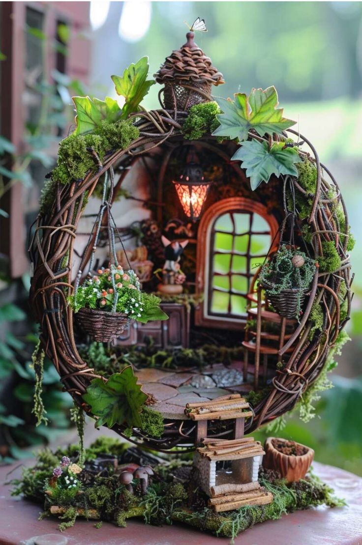 a miniature house made out of twigs and plants