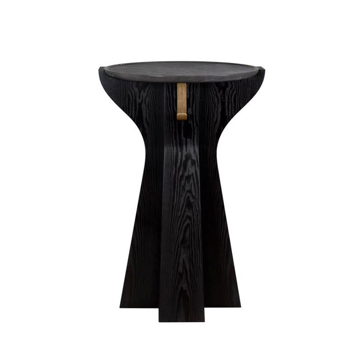 the side table is made from black wood and has a wooden top with a gold accent