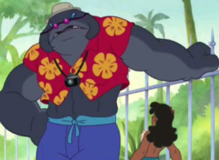 an animated gorilla is standing next to a woman in blue shorts and a red shirt