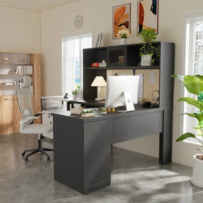 an office area with a desk, chair and bookshelf