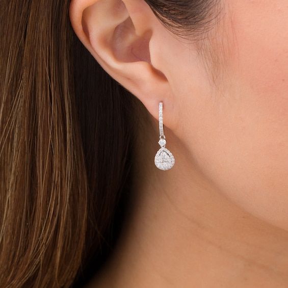 Elevate your dressy looks with these elegant multi-diamond teardrop hoop earrings. Created in 14K white gold Each drop showcases a teardrop-shaped composite of diamonds wrapped in a diamond-lined frame. A shimmering diamond connects the dangle to the diamond-adorned hoop. These 1 cts. t.w. diamond earrings secure with hinged backs. Diamond Earrings Wedding, Teardrop Hoop Earrings, France Style, Teardrop Diamond, Drop Hoop Earrings, Mangalsutra Designs, Bride Earrings, Hanging Earrings, Dangly Earrings