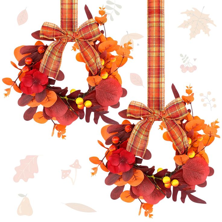 two wreaths with plaid bows and autumn leaves