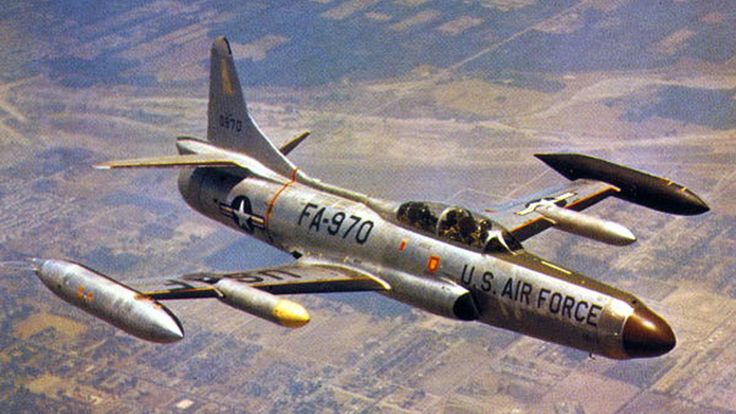 an air force jet flying through the sky