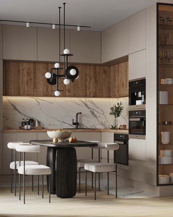 a modern kitchen with marble counter tops and wooden cabinetry, along with white chairs