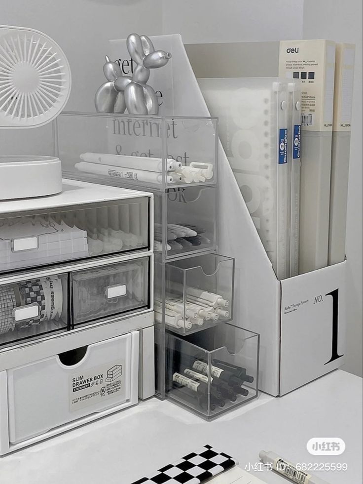 an assortment of office supplies on display in a white room