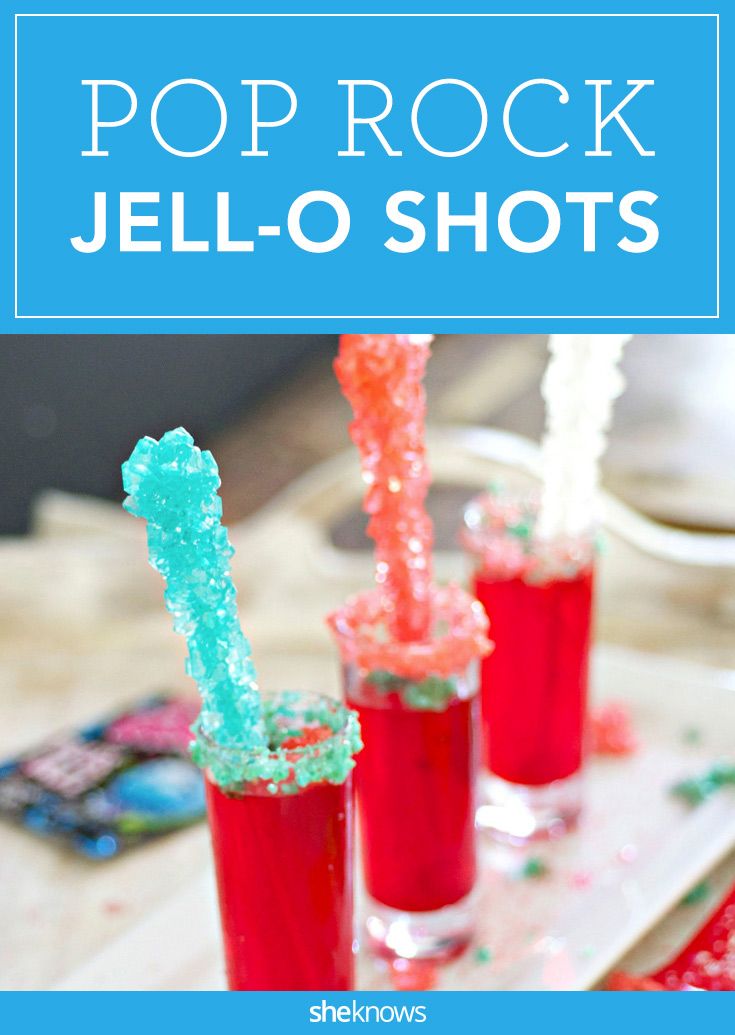 three glasses filled with jello and sprinkles on top of a table