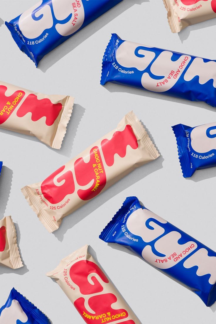 several different types of candy bars laid out on top of each other, including one with the letter g