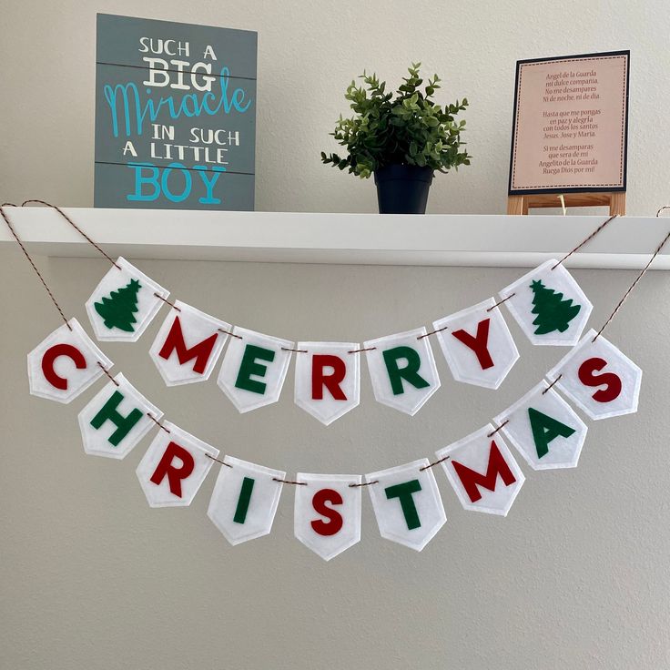 merry christmas banner hanging on the mantle