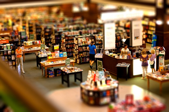 an overhead view of a book store filled with books and people standing in the aisles