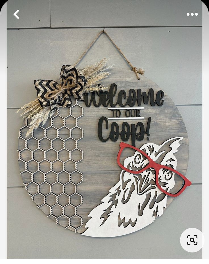 a wooden sign that says welcome to the coop with an image of a chicken wearing glasses