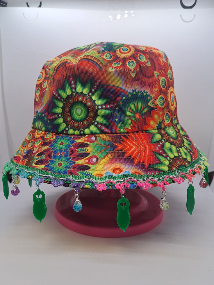 Kevin the alien balloon bucket hat! Perfect for a show or festival!  Size: Medium - One size fits most It is recommended that these bucket hats are handled with care due to the design including dangling charms.  *Each item is handmade and made-to-order so there may be slight varients between each hat in terms of pattern position, charm position, etc. Rave Bucket Hat, Playful Sun Hat With Curved Brim For Festivals, Playful Festival Sun Hat With Curved Brim, Playful Curved Brim Sun Hat For Festivals, Summer Rave Festival Hats, Whimsical Adjustable Multicolor Sun Hat, Adjustable Summer Rave Hats, Adjustable Wide Brim Hat For Carnival, Fun Carnival Festival Costume Hats And Headpieces