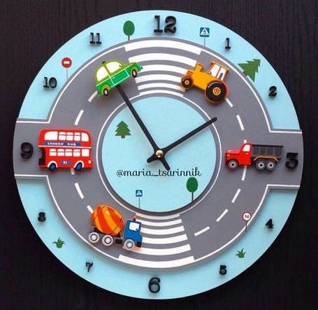 a clock with cars and trucks painted on the face is shown in front of a black background