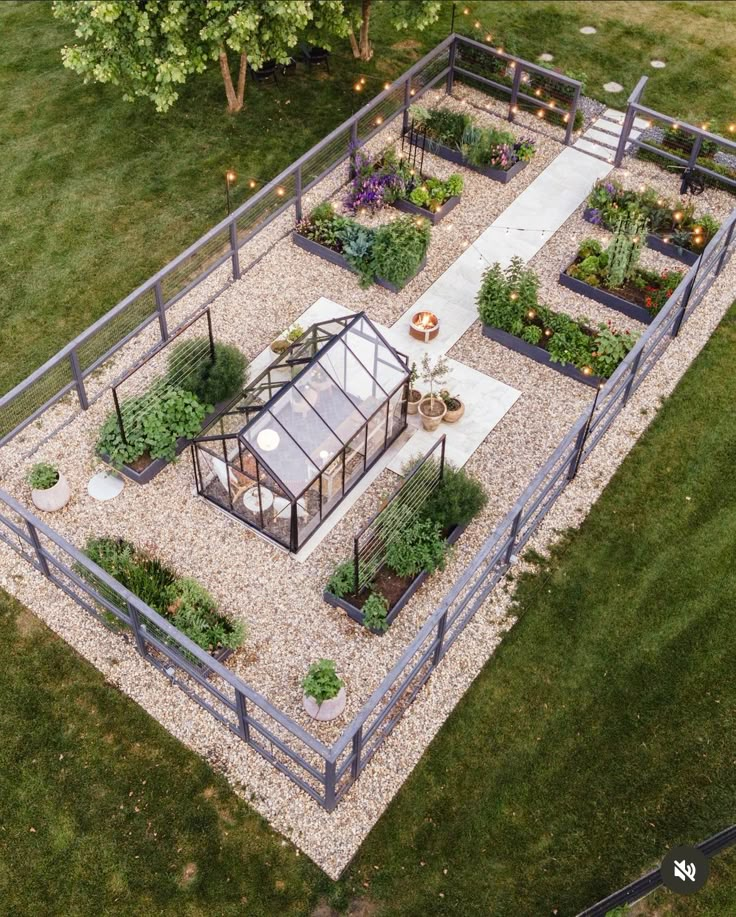 an aerial view of a small garden with lots of flowers and plants in the center