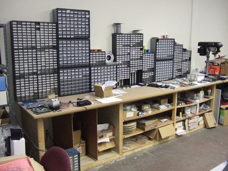 a room filled with lots of different types of boxes and shelves on top of each other