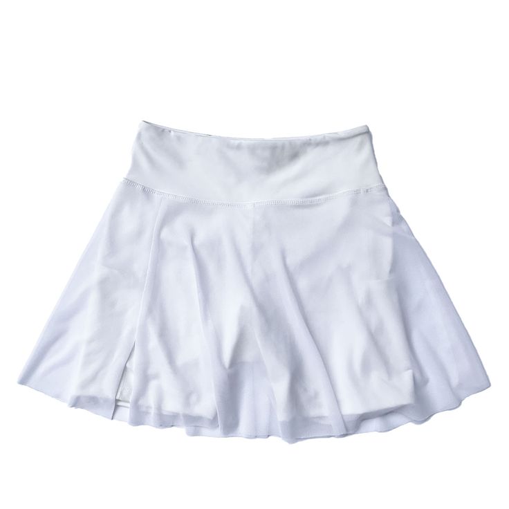 The White Pocket Skort is *the* perfect piece that combines your favorite elements of a fashionable tennis skirt and a workout short. A tennis skirt with a twist, in basic blackt, to wear to your favorite workouts, or out on the town. The built-in shorts are shaped to hug and sculpt your curves in our buttery-soft, 4-way stretch, moisture-wicking fabric. Pair it with the matching the Greece sweater for a preppy look or with any of our Bras under a Jacket down for a chic look.  One side open mesh skirt. Built-in sculpting short. Side pocket short. Short inseam 5”long. High waist. Machine wash cold cycle or hand wash, do not bleach, do not tumble dry, do not iron, do not dry clean Materials: 74% Polyester 26% Elastane - Recycled yarn Fabric properties: Antibacterial, Moisture Wicking, 4 way White Skort, Workout Short, High Fashion Looks, Short A, Preppy Look, Recycled Yarn, Mesh Skirt, Pearl Jewellery Earrings, A Workout