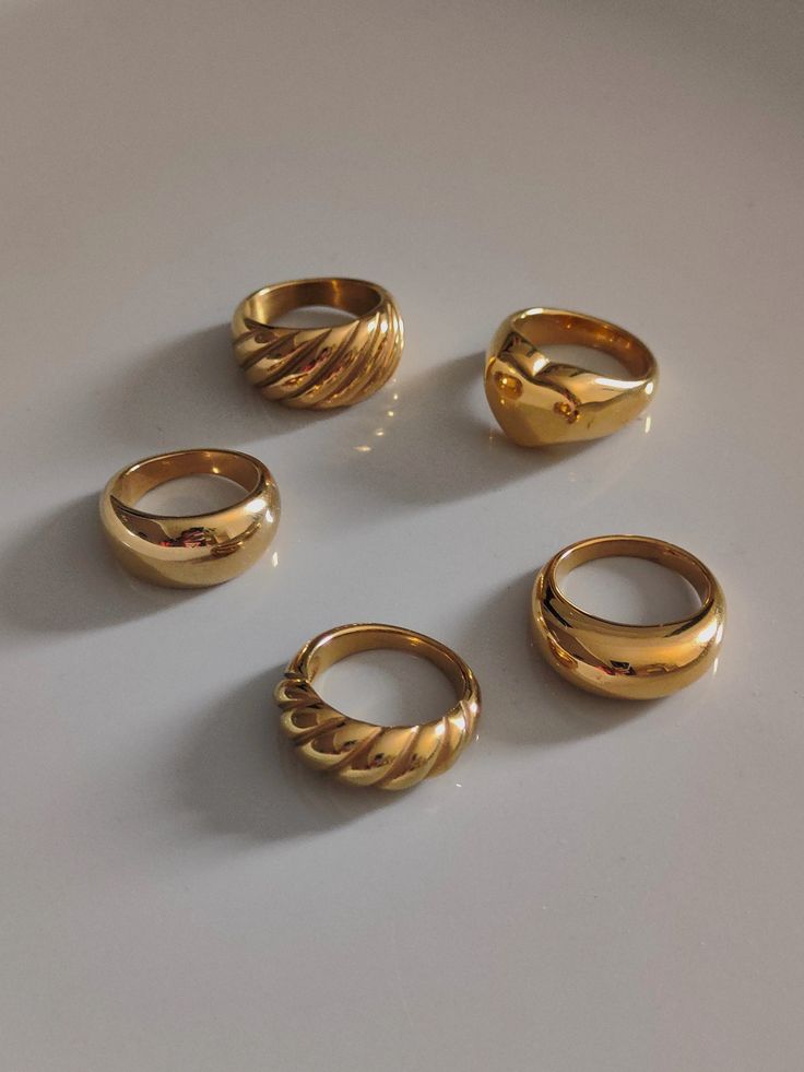 We offer chunky gold rings at affordable prices. Since chunky rings are so popular, I made a special collection for them. Large dome rings, chunky croissant rings, double dome rings, chunky love rings. As a beautiful stainless steel-based gold band, it lasts forever and will always look good. A single ring is stylish enough, but a couple does look very fancy together. ♥ SIGN UP for 10% OFF your first order: https://bit.ly/3olIlWf ♥ DETAILS - Materials: Stainless steel, 18k gold plating. - Nickel Bulky Rings Women, Gold Chunky Rings Aesthetic, Gold Thick Ring, Chunky Jewelry Rings, Chunky Gold Rings Vintage, Thick Rings For Women, Classy Gold Rings, Gold Ring Chunky, Gold Rings Thick