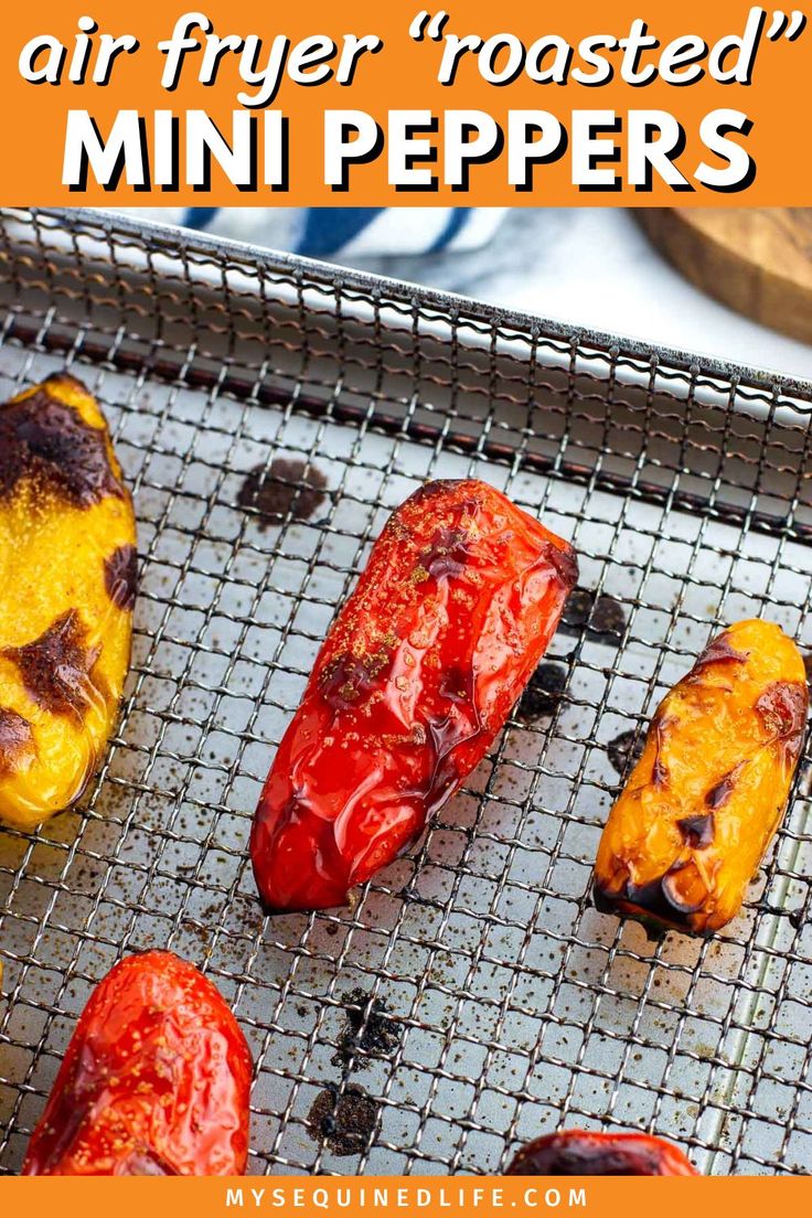 An assortment of mini peppers on an air fryer basket with roasted, blistered skin. Air Fryer Mini Peppers, Air Fryer Roasted Peppers, Roasted Mini Peppers, Skin Blisters, Onion Grilled Cheese, Mini Peppers, Roasted Poblano Peppers, Long Pepper, Mini Sweet Peppers