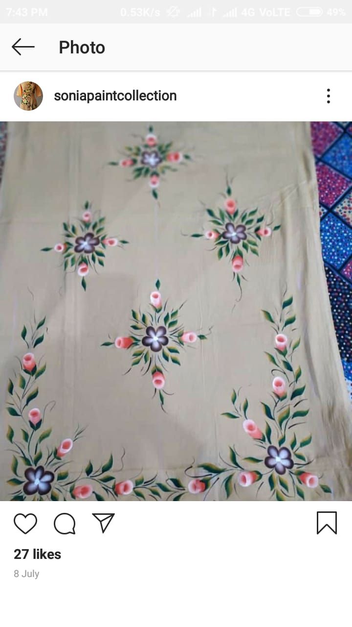 an image of a table cloth with flowers and leaves on it, in the middle of a