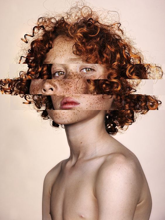 a woman with freckles on her face and hair