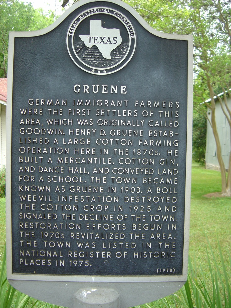 a plaque in front of a house that reads grulene, german immigrant farmer's were the first settlers of this area, which was originally called