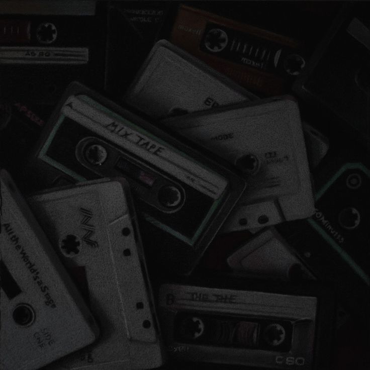 a pile of old cassette tapes sitting on top of each other