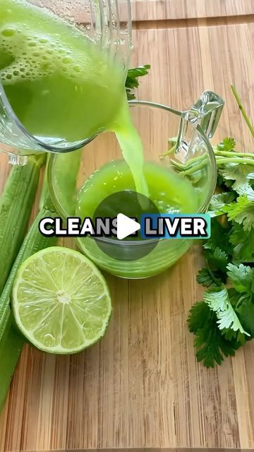 green liquid being poured into a glass pitcher next to celery and limes