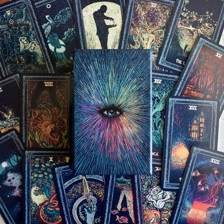 an assortment of tarot cards with artwork on them