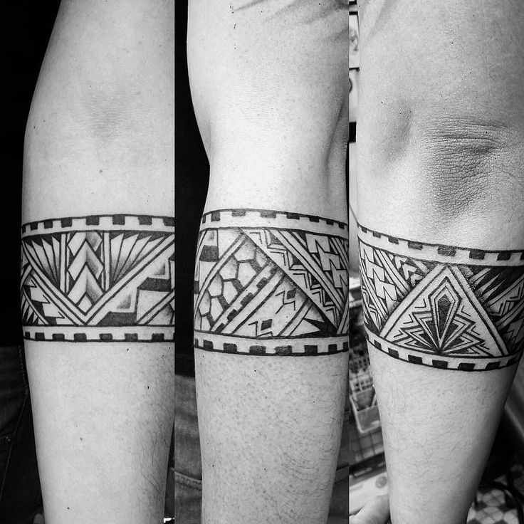 two men's legs with tattoos on them, both showing the same design as they are