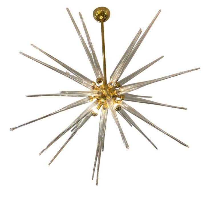 a chandelier that is hanging from the ceiling, with several small glass rods attached to it