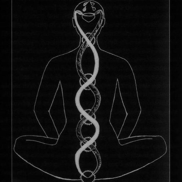 a man sitting in the middle of a yoga pose with a spiral design on his back