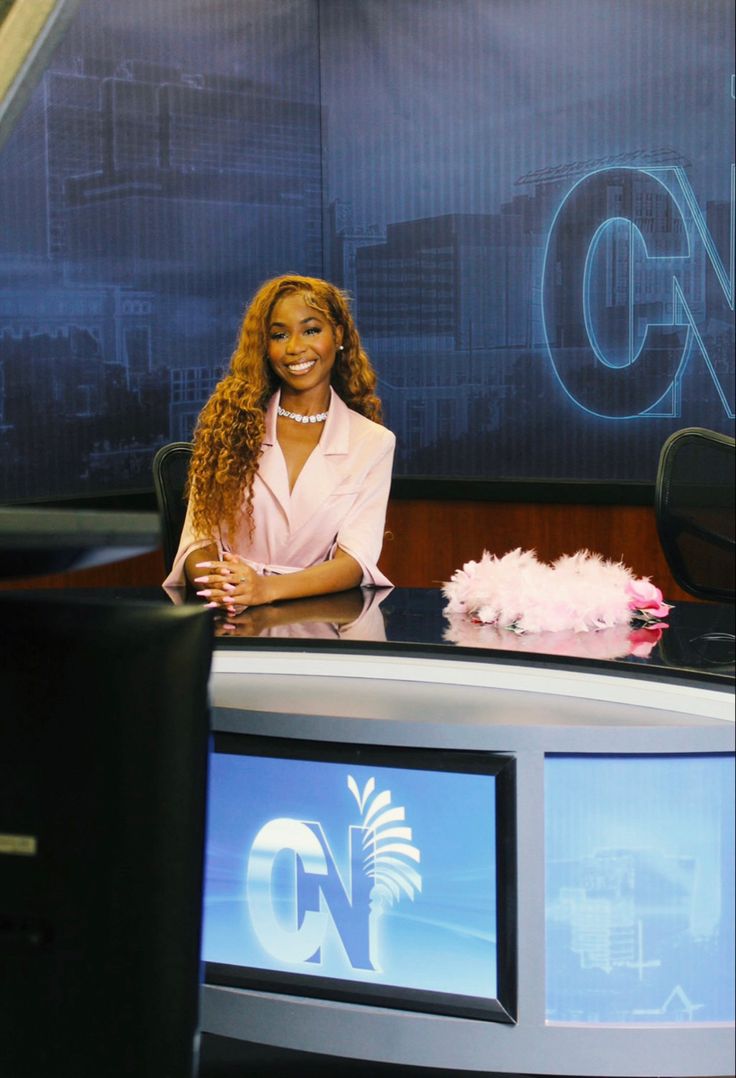 a woman sitting in front of a tv set