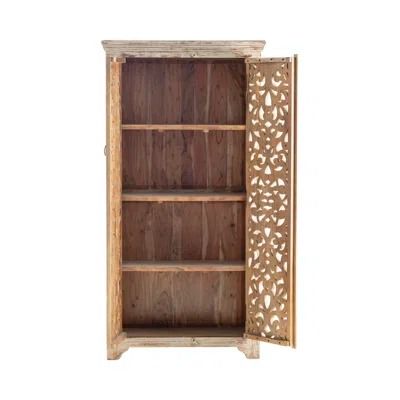 an open wooden bookcase with carvings on the front and side panels, against a white background