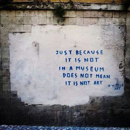 graffiti on the side of a building that says, just because it is not in museum does not mean it is not art