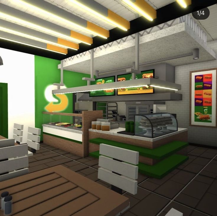 the interior of a fast food restaurant with green walls and white ceilinging, along with wooden tables and chairs