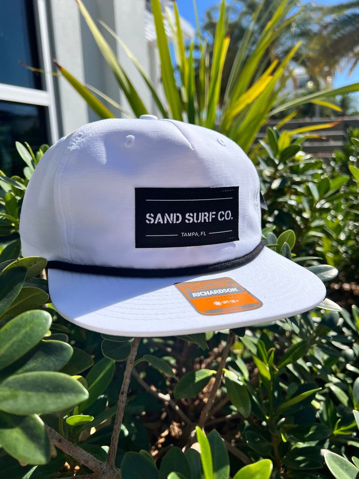 Stay Sandy with the Sand Surf Co. Richardson Patch Logo Hat! Flip-up buckram and a 5mm rope give this cap a unique look that’s sure to turn heads both up and down stream. Perfect for backpacking, trail-running, or day hiking. UPF RATING: 50+ SHAPE Flip-Up Stay Pinch FABRIC Cotton/Nylon VISOR Flat SWEATBAND Cotton MATERIAL 85% Cotton, 15% Nylon CONSTRUCTION Woven Adjustable SnapbackOSFM (7 – 7 3/4) Freestyle Watch, Richardson Hats, Surf Hats, Orange Hat, Day Hiking, Fall Style Guide, Womens Hats, Sup Accessories, Sand Surfing