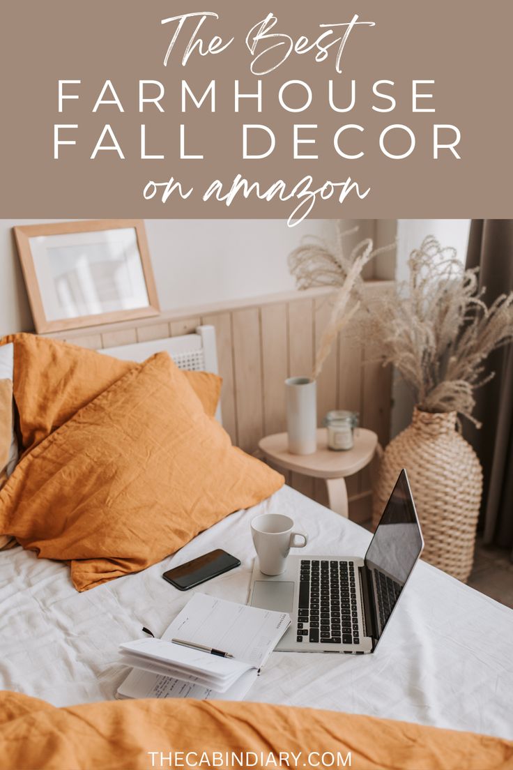 a bed with an open laptop on it and the text overlay reads, the best farmhouse decor on amazon