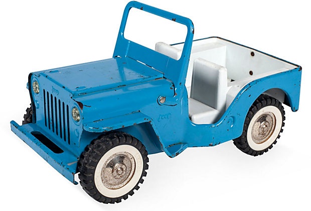 a blue toy jeep with white wheels on a white background