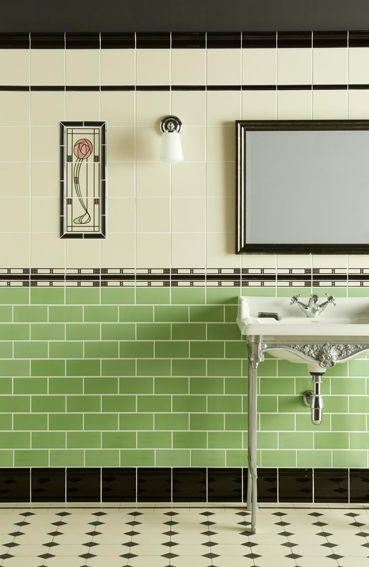 a sink and mirror in a room with green tiles on the walls, black and white checkered flooring