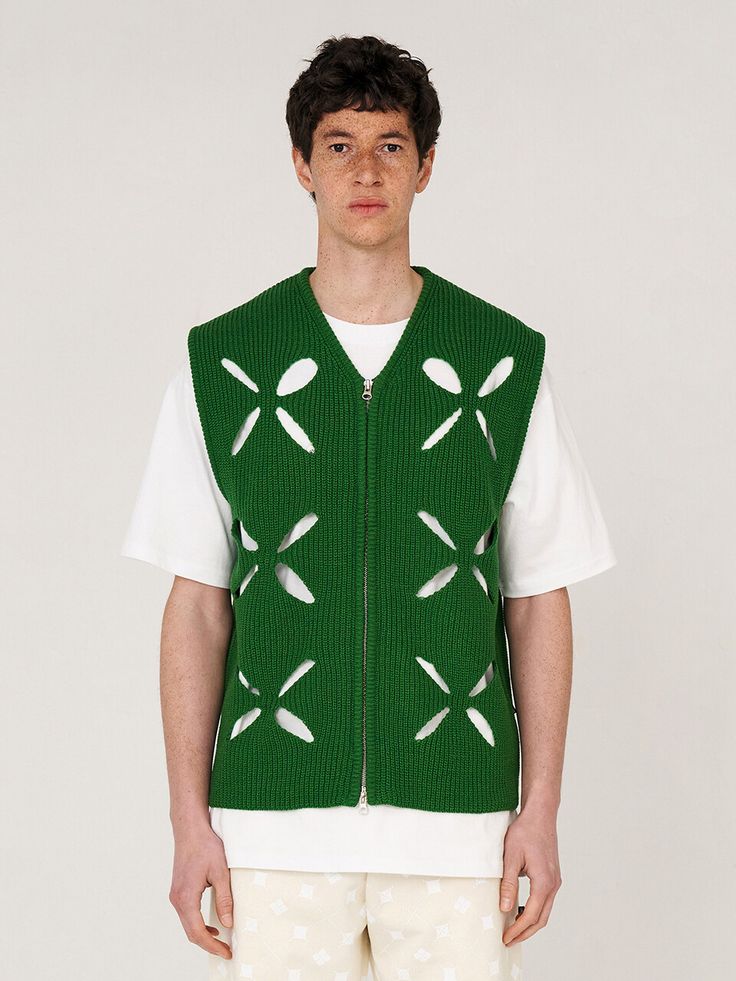 Editor's NotesUNALLOYED’s knit vest gives casual look with semi-oversized fit and clover hole pattern.- Semi-oversized fit- V-neck knit vest- Clover hole pattern- Logo label at side- Zipper closure- Wool blend fabric Measurements(in.)S / L- Length: 25.6in. / 26.8in.- Chest: 20.9in. / 22.4in.- Shoulder: 16.5in. / 18.1in.- Armhole: 9.8in. / 10.2in.*Model Info: 6’1’’ 154.3lbs Bust 35.4’’ Waist 28.0’’ Fitting Size L*Model Info: 5’10’’ 117.9lbs Bust 30.7’’ Waist 28.3’’ Fitting Size L*Model Info: Casual Green Knit Vest, Spring Green Knit Vest, Green Sleeveless Vest With Patchwork, Green Knit Vest, Green Military Sleeveless Vest, Khaki Military Vest With Side Pockets, Mens Photoshoot, Mens Photoshoot Poses, Pattern Logo