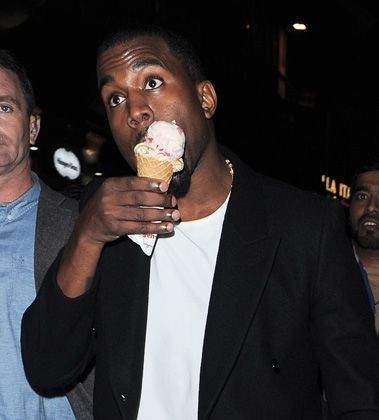 a man is eating an ice cream cone