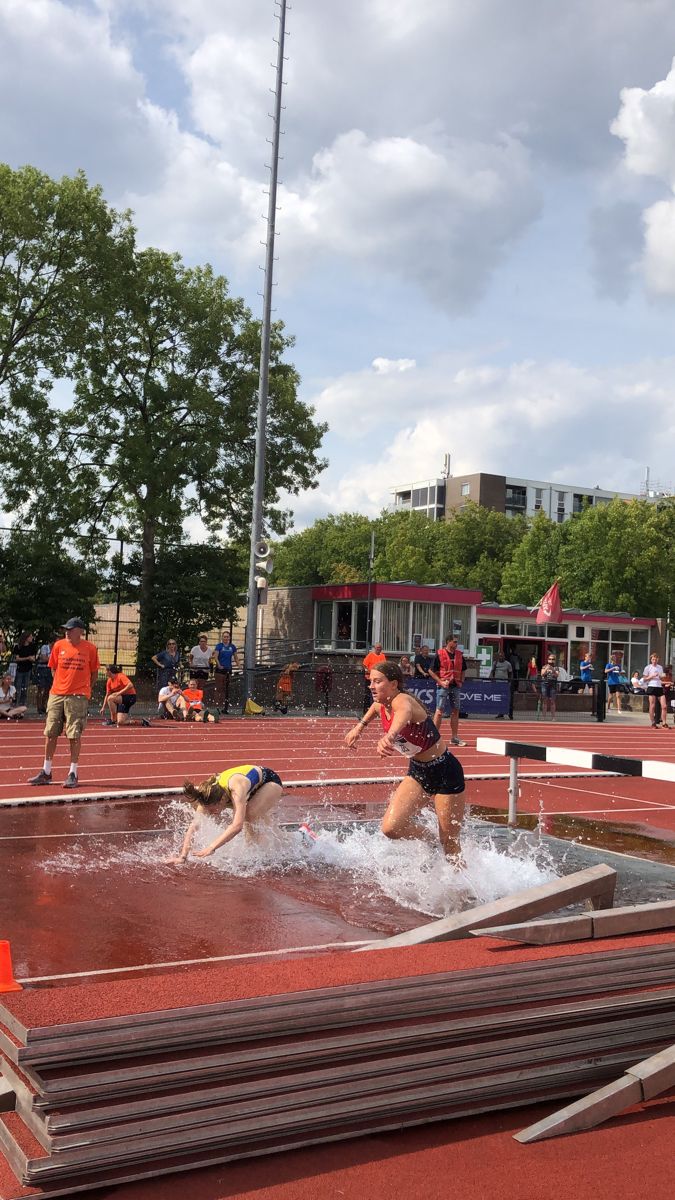 some people are playing in the water on a track