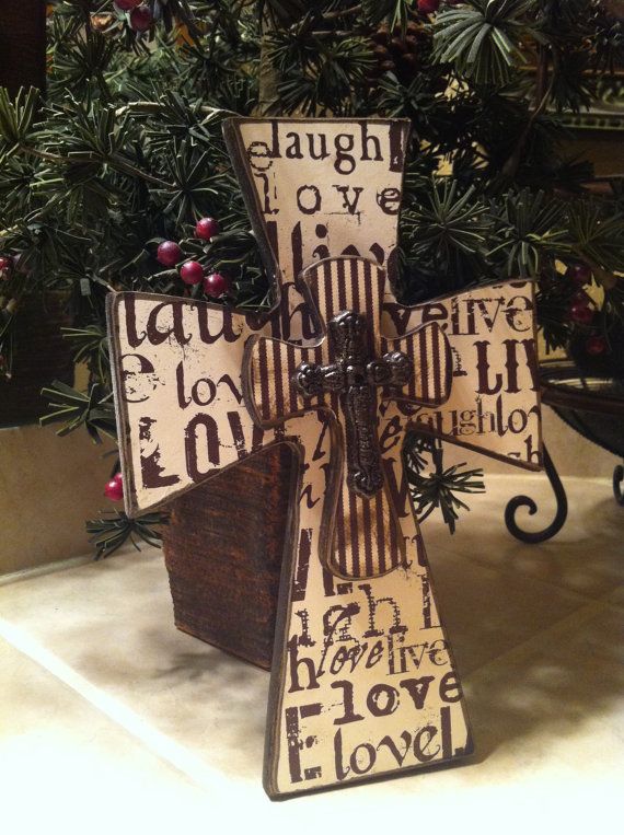 a wooden cross sitting on top of a table