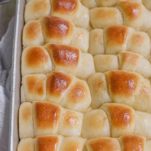 a baking pan filled with hot cross buns