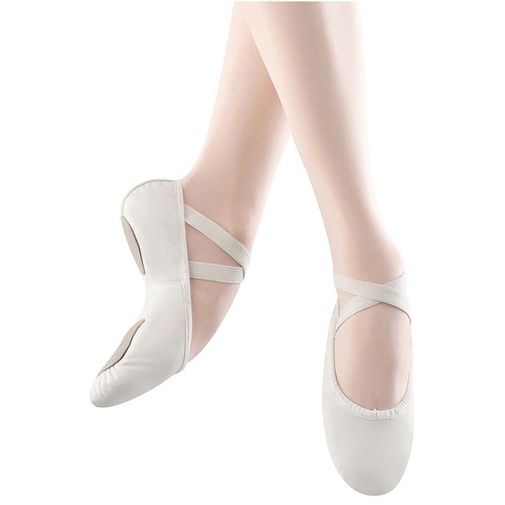 a pair of white ballet shoes with straps