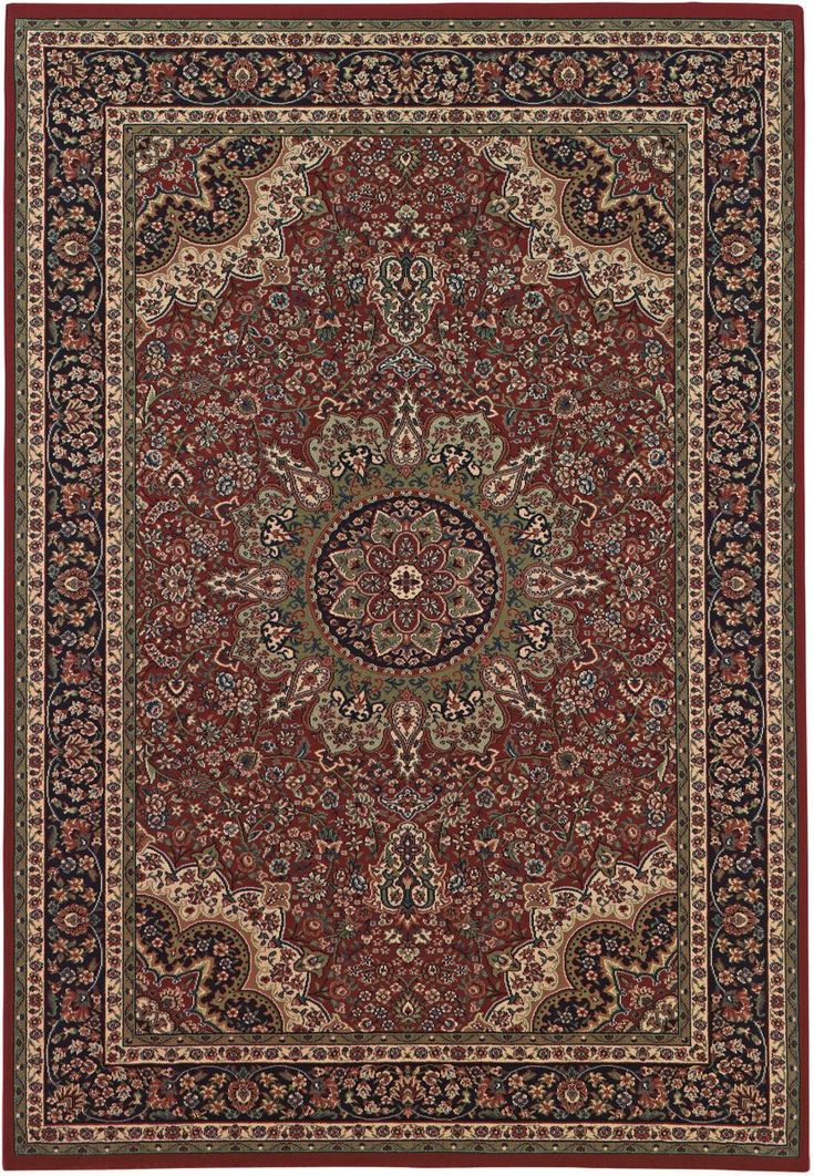 a red and black rug with an ornate design on the center, surrounded by smaller floral designs