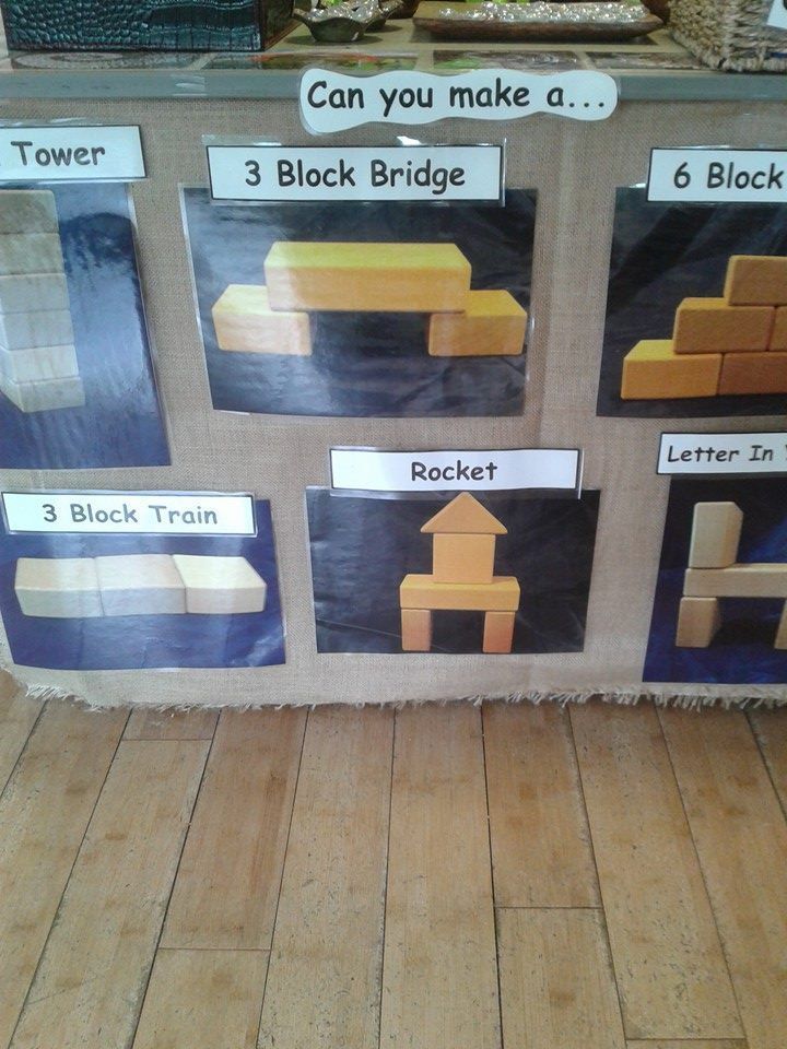 a display in a store with different types of bricks on the wall and below it are instructions for how to make a block bridge