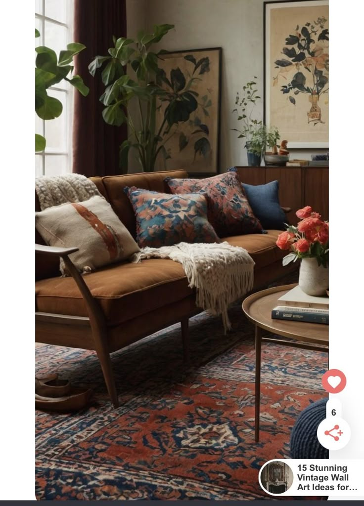 a living room filled with lots of furniture and flowers on top of a rug in front of a window