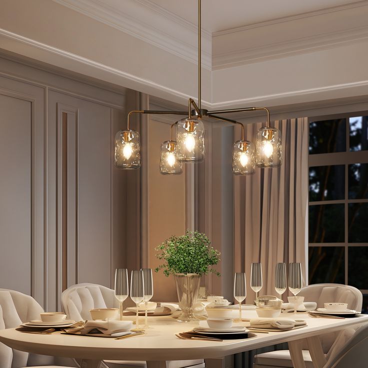 a dining room table with white chairs and lights